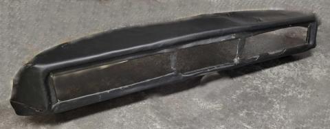 Photo of the dashboard shell trimmed with black vinyl